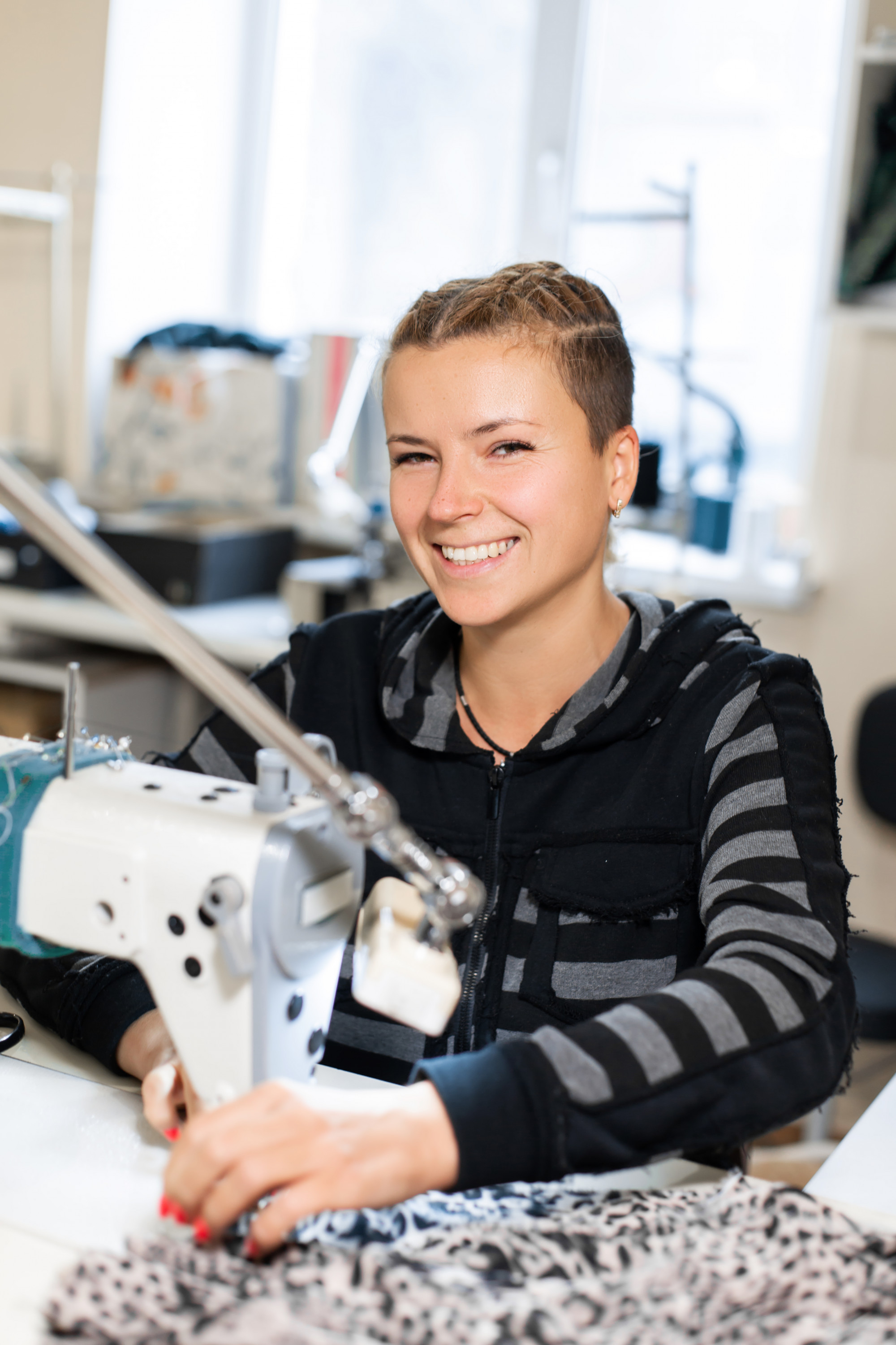 workspace portrait with a technician and embroidery machine